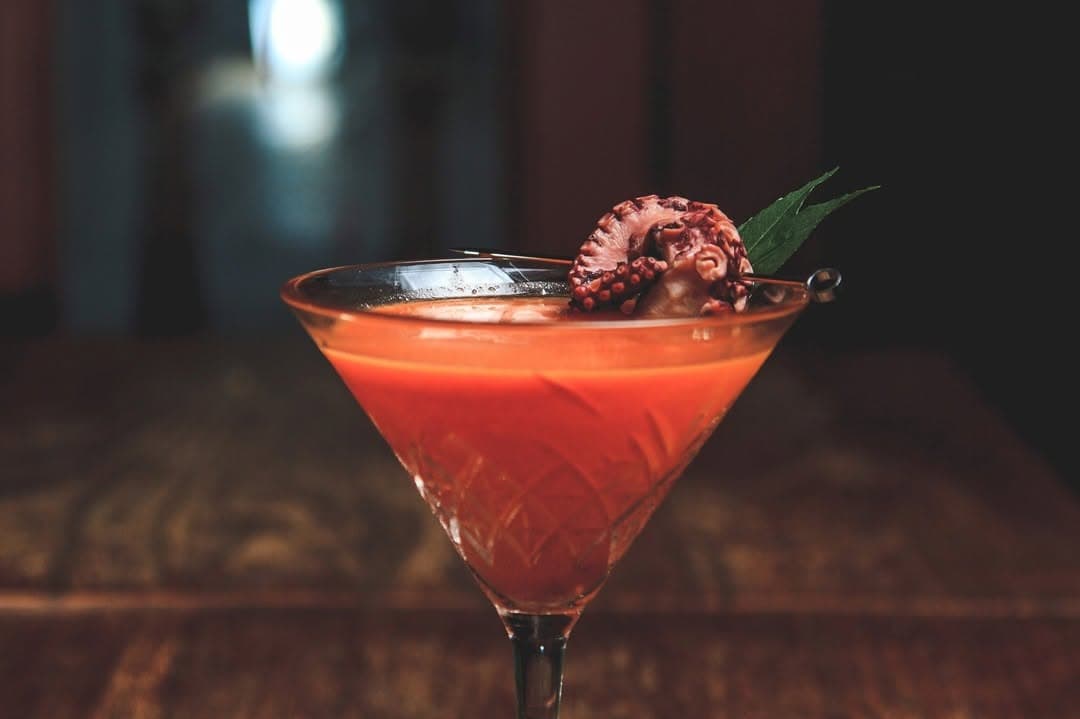 Experimental Oriental Elixir cocktail finished with an octopus garnish