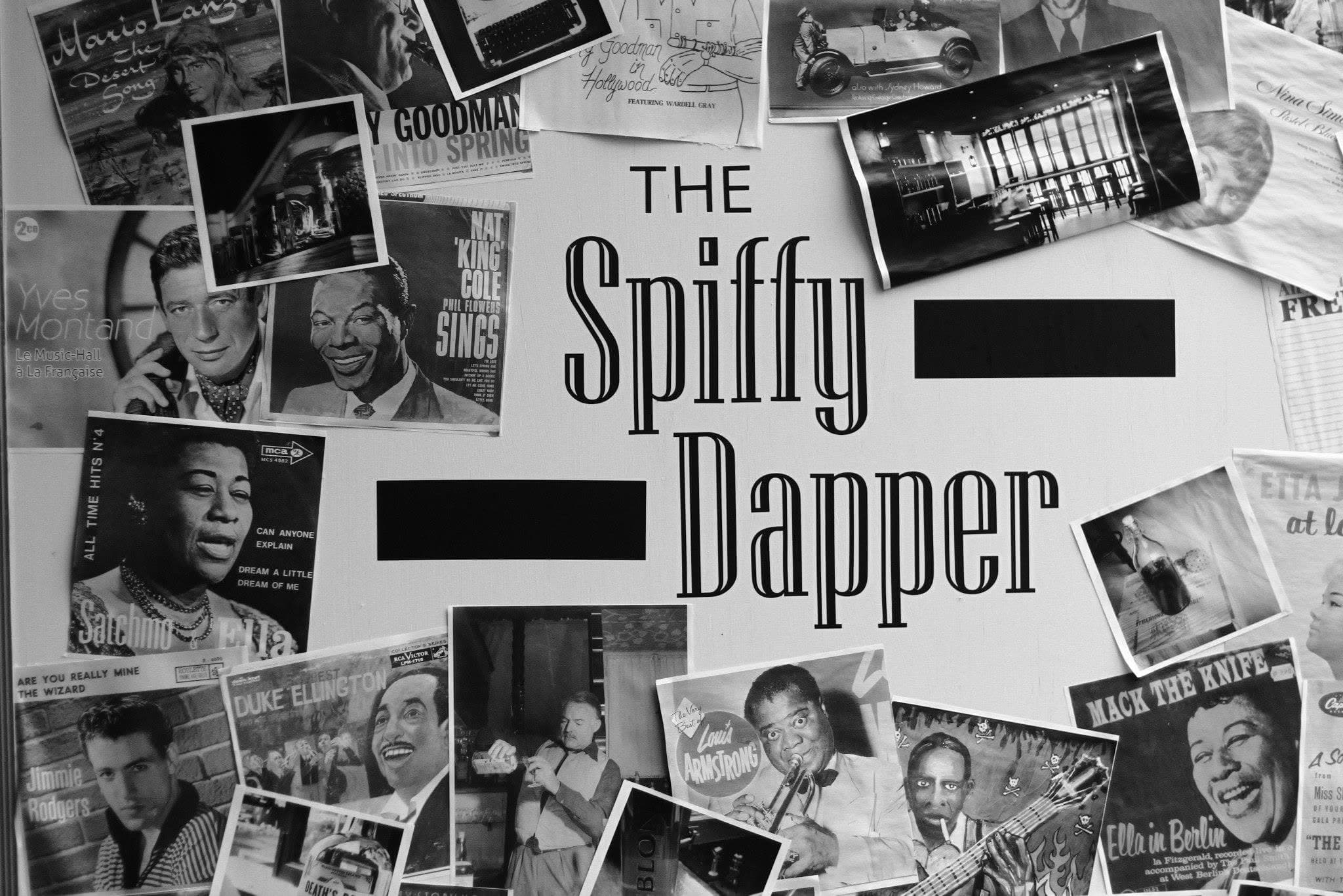 Vintage jazz album art and hand-painted signage wall at The Spiffy Dapper